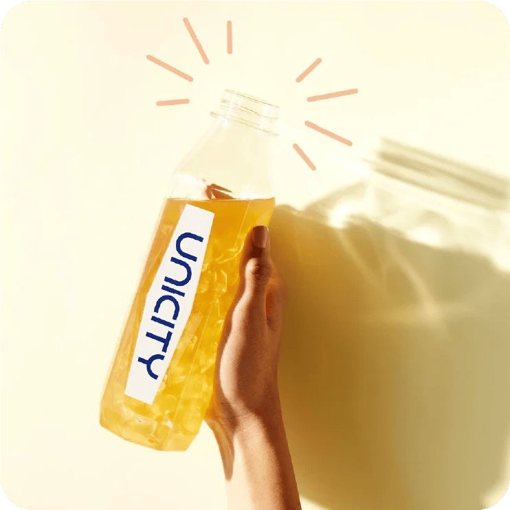 Unimate bottle held up to the morning sun
